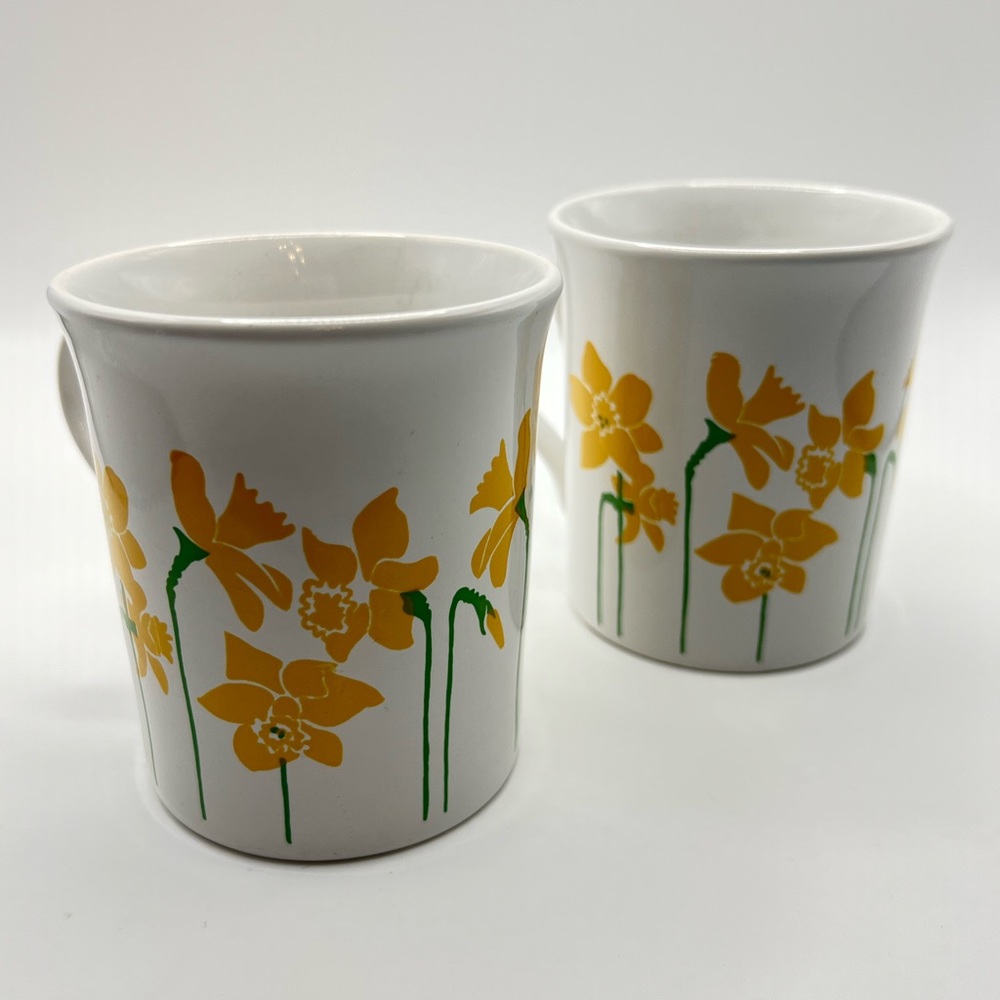 Pair of daffodil print coffee mugs made in England.